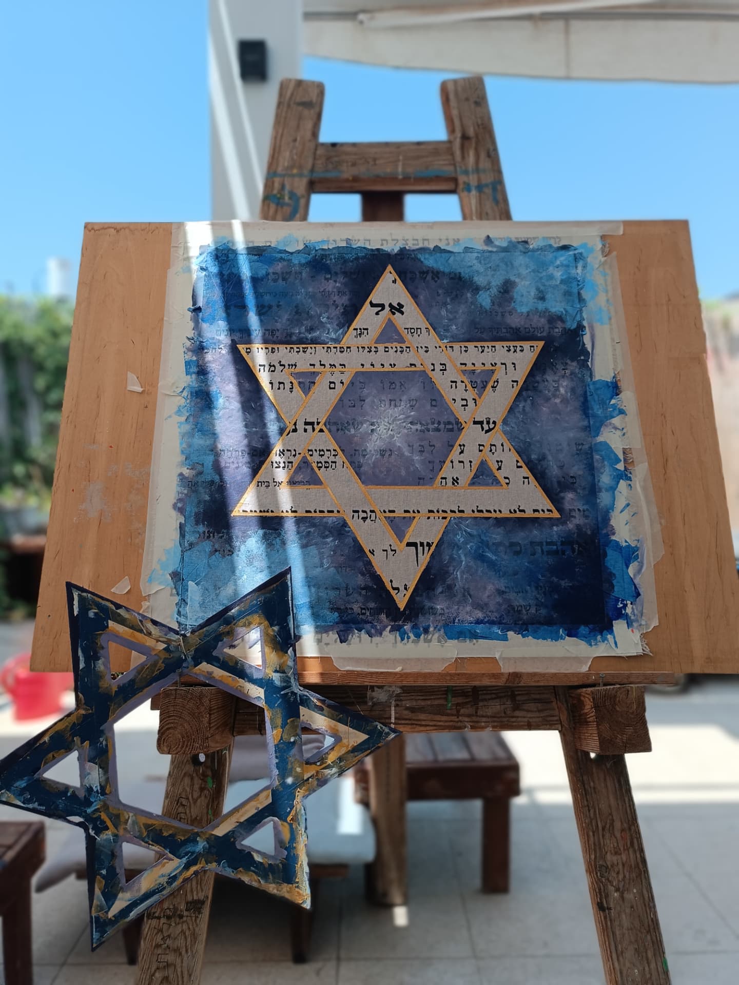 Star of David painting on an easel in the studio